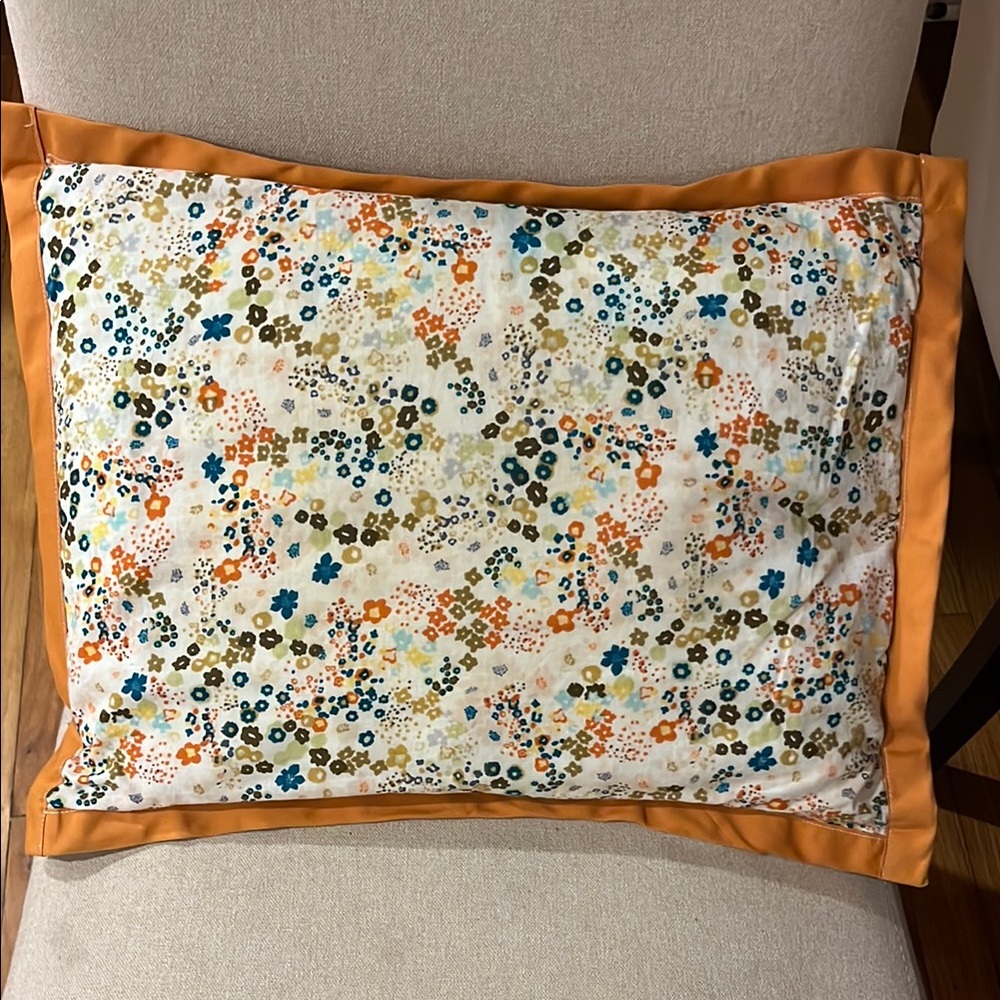 Handmade floral accent pillowcase with orange trim